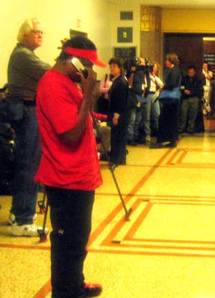 young man who was arrested for speaking out in court